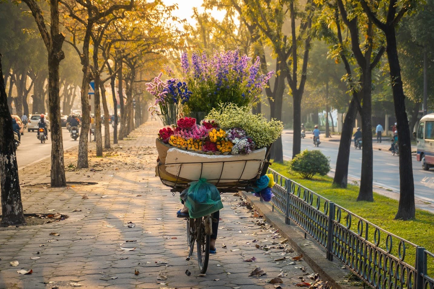 Street vendor carrying a flower basket in Hanoi's Old Quarter